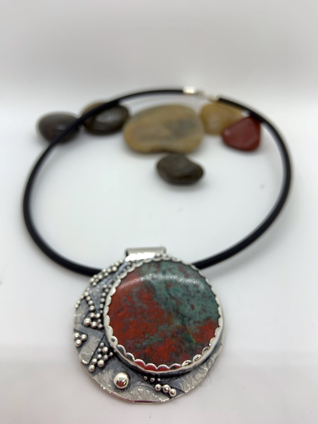 Sterling silver  pendant with a Sonaran Sunrise cabochon on an 18 “ 4 mm leather cord.