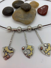 Load image into Gallery viewer, Sterling silver necklace with 18 K bimetal, and copper accents on adjustable leather strap
